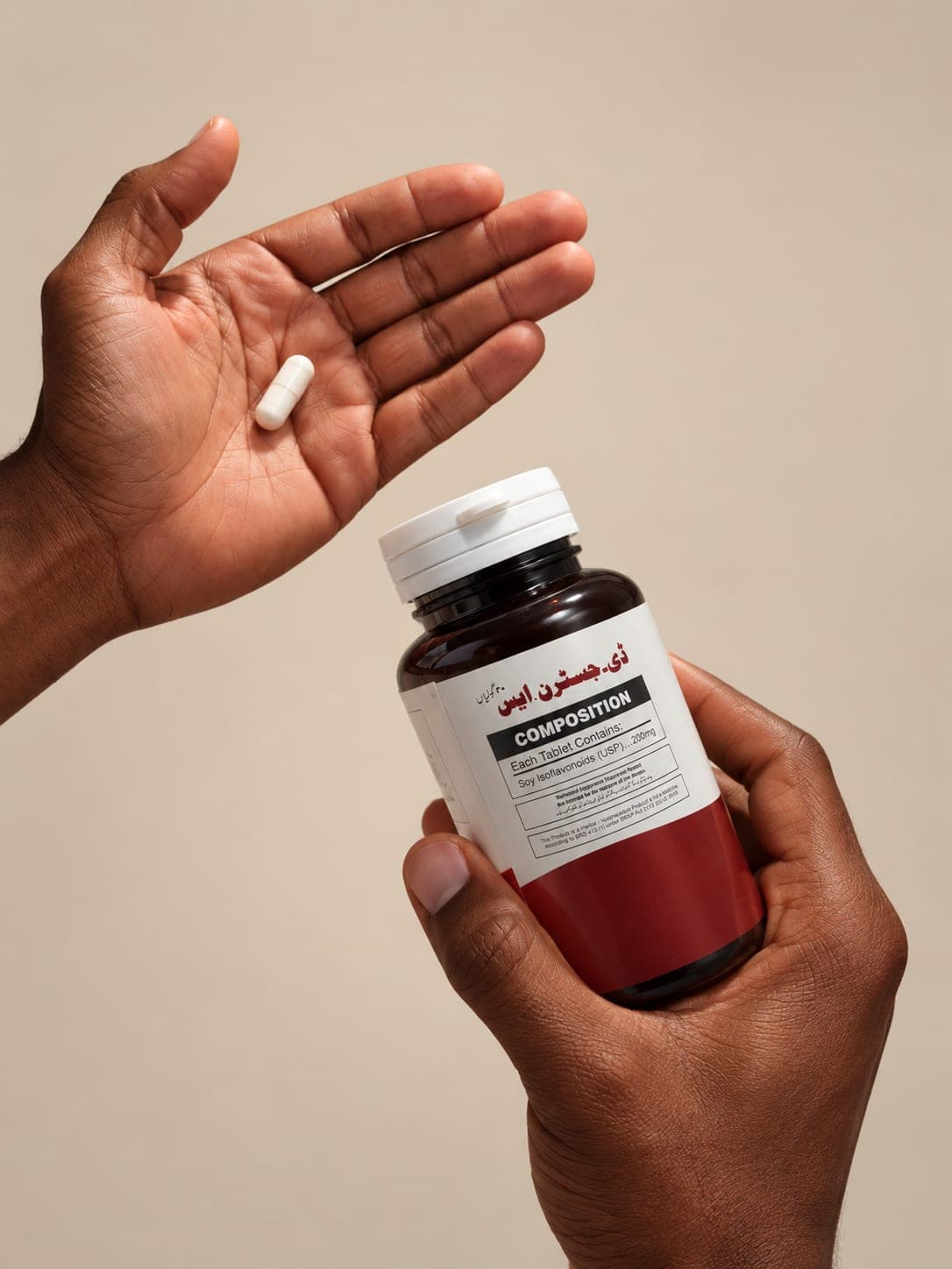 Hand holding a D-GESTRN.S bottle and a capsule